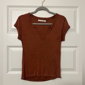 Free People size S; Rust colored vneck shirt